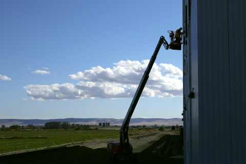 thumbnail The artists used a boom lift to paint the giant mural, the largest of its kind in the world at 44 by 66 feet. (Photo: Business Wire)