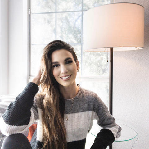 Actress Christy Carlson Romano is seen at home with a Lamps Plus floor lamp. Romano will post a video on TikTok showing how her family adjusts to Daylight Savings Time ending as part of a Lamps Plus promotion and giveaway. (Photo: Business Wire)