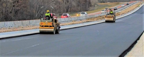 original New Village Initiative Advanced Materials Group's NewRoad™ hybrid polymer asphalt additives have performed well for five years on state, county and city roads and highways and commercial parking lots. (Photo: Business Wire)