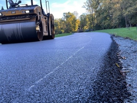 New Village Initiative Advanced Materials Group's NewRoad™ asphalt additives are engineered with waste plastic and make roads such as this one in a Pennsylvania state park last as much as 50% longer. NVI welcomes the partnership with Pennsylvania state agencies and is pursuing similar projects nationwide. (Photo: Business Wire)