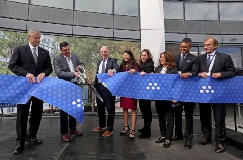 MassMutual Chairman, President and CEO Roger Crandall (second from left) cuts the ceremonial ribbon at MassMutual’s new Boston campus at 10 Fan Pier in the Seaport. (l-r) Massachusetts Governor Charlie Baker; Roger Crandall, Chairman, President and CEO of MassMutual; Joe Fallon, Founder, President and CEO of The Fallon Company; Sahang-Hee Hahn, Head of Flourish Platform at MassMutual; Siobhan Dullea, CEO of MassChallenge; Karyn Polito, Lt. Governor of Massachusetts; Imari Paris Jeffries, King Boston; and, David Manfredi, CEO and Founding Principal of Elkus Manfredi Architects celebrate the Grand Opening and a $1 million gift to King Boston, honoring company’s commitment to mutual values. (Photo: Business Wire)