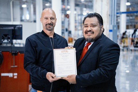 Matt Tall, VP of Manufacturing for Faraday Future receives the Certificate of Occupancy for the major manufacturing area of its Hanford, Calif. manufacturing plant, delivered personally by Francisco Ramirez, Mayor of Hanford. (Photo: Business Wire)