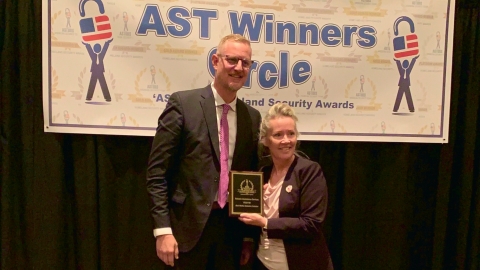 Mark Folmer, RAD President and COO accepting the 2021 AST 'ASTORS' Award for Best Robotic Perimeter Protection from Tammy Waitt, AST Editorial Director (Photo: Business Wire)