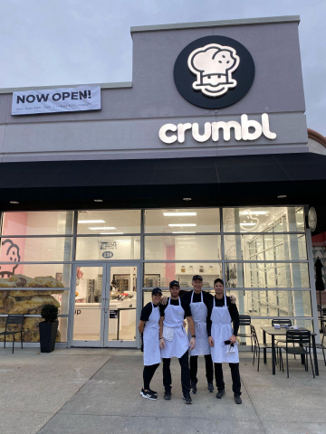 Crumbl Cookie’s unique open-kitchen experience where you actually see your Crumbl crew mix, bake, and prepare fresh cookies. (Pictured from left to right at their flagship store in Methuen, Massachusetts: Angela Maguire, James Maguire, Steve Menzel and Jeff Maguire). (Photo: Business Wire)