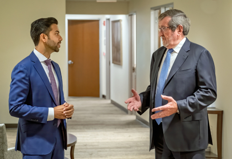 Michael Dowling (right), president and CEO of Northwell Health speaks with Chethan Sathya, MD, director of Northwell’s Center for Gun Violence Prevention. (Credit: Northwell Health)