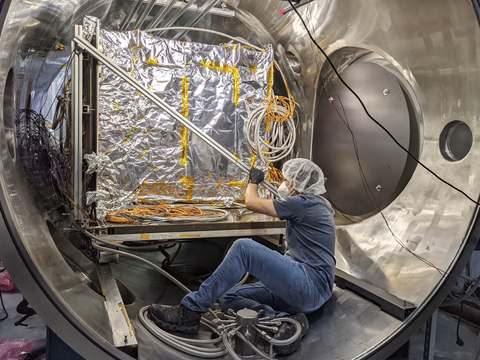 Astranis employee with 'Arcturus' MicroGEO satellite inside TVAC test chamber. (Photo: Business Wire)