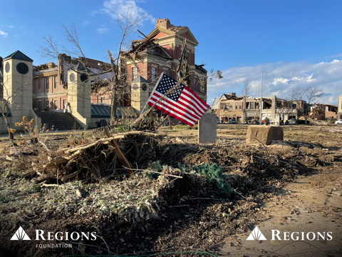 An American flag, placed outside the heavily damaged Graves County Courthouse in Mayfield, Kentucky, stands as a testament to the community spirit fueling the recovery underway in areas across the South and Midwest that were impacted by the Dec. 10-11 storms. The Regions Foundation and Regions Bank are launching a comprehensive response to the storms. Photo taken by Kim Moore, Regions Bank. (Photo: Business Wire)