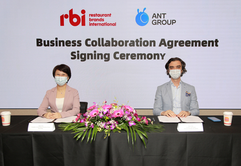 Business Collaboration Agreement Signing Ceremony between RBI and Ant Group (left: Angel Zhao, President of Ant Group’s International Business Group, right: Ekrem Ozer, President of APAC, Restaurant Brands International) (Photo: Business Wire)
