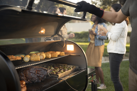 Weber SmokeFire Wood Fired Pellet Grill, STEALTH Edition, with WEBER CRAFTED Outdoor Kitchen Collection grillware. (Photo: Business Wire)