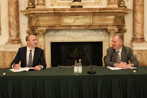Trevor Fox, HID Global Head of Finance for Citizen Identity Solutions Business Area (left) and John Conlan, COO/CFO of Department of Foreign Affairs Ireland (right) sign the country’s new passport issuance and processing agreement in Galway, Ireland. (Photo: Business Wire)