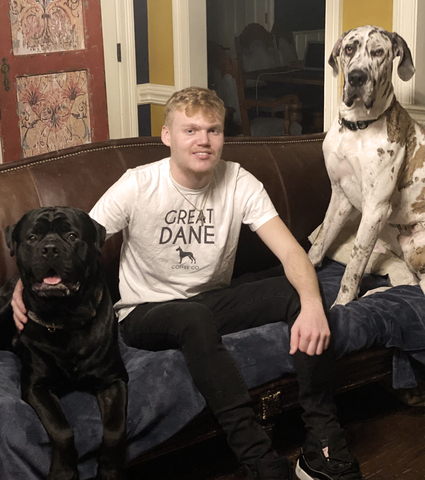 Better Place Brands Founder Oliver Carson with the dogs who inspired his company, Monty (left), and Fetty (right). Monty is a Rotty-Corso mix and Fetty is a Great Dane. Better Place Brands supports 130 dog rescues and shelters, nationwide. (Photo: Business Wire)