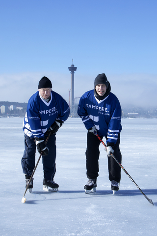 Local hockey legends Lasse Oksanen (left) and Ville Nieminen (right) on the ice of Lake Näsijärvi in Tampere. Oksanen has scored most international goals (101) for Team Finland. Nieminen won NHL Stanley Cup with Colorado Avalanche in 2001. (Photo: Business Wire)