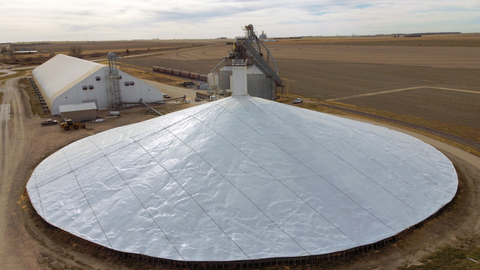 Custom-fabricated to fit piles of any shape and size, Raven Engineered Films' patent pending DuraCinch Strapping System is designed to secure grain covers in extreme elements, providing greater and longer-lasting protection for major grain pile storage. (Photo: Business Wire)