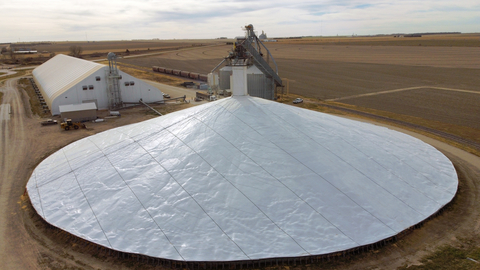 original Custom-fabricated to fit piles of any shape and size, Raven Engineered Films' patent pending DuraCinch Strapping System is designed to secure grain covers in extreme elements, providing greater and longer-lasting protection for major grain pile storage. (Photo: Business Wire)