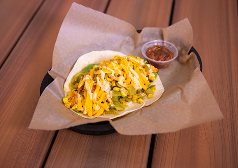 Torchy's fan-favorite, Tipsy Chick, is now back on the menu at all locations, featuring marinated and grilled chicken breast, spinach, grilled corn, green chiles and cheddar cheese with chipotle sauce on a flour tortilla, served with a side of scratch-made bacon bourbon marmalade. (Photo Credit: Torchy's Tacos)