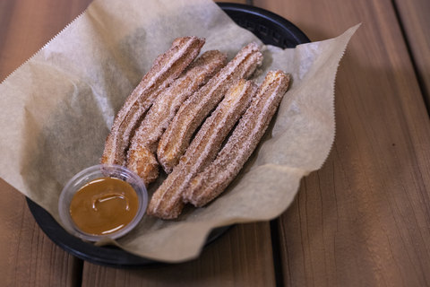 Treat yourself with something sweet during the month of love! Torchy’s new Churros are scratch-made with buttermilk and dusted with sugar and cinnamon, served with a side of dulce de leche. (Photo Credit: Torchy's Tacos)