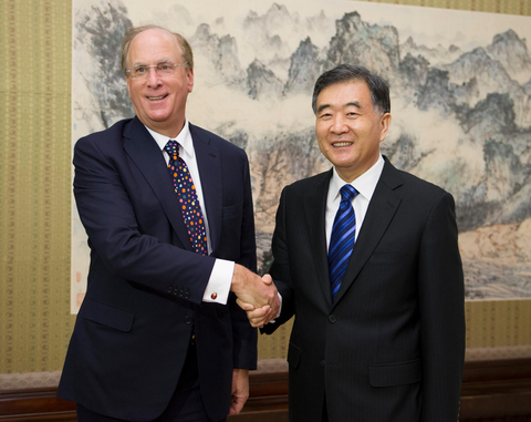 Chinese Vice Premier Wang Yang (R) shakes hands with Laurence D. Fink, chairman and Chief Executive Officer of BlackRock Inc., during their meeting in Beijing, capital of China, Feb. 18, 2014. (Photo: Business Wire)