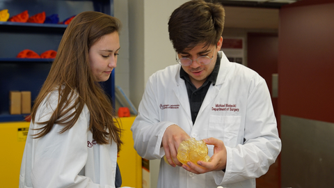Students look at a 3D printed anatomic model in the University of Minnesota Visible Heart Laboratories. Credit: U of M Medical School | Visible Heart Laboratories
