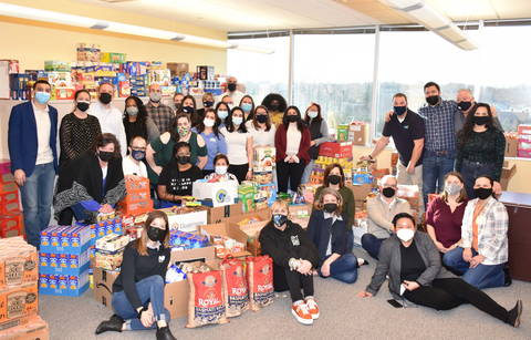 Northwest employees with the Souper Bowl's 12K+ donations (Photo: Business Wire)