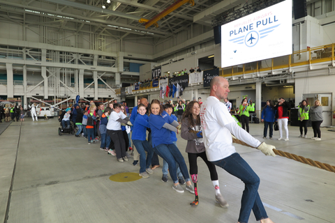 Attendees take part in the Republic Airways Plane Pull. (Photo: Business Wire)