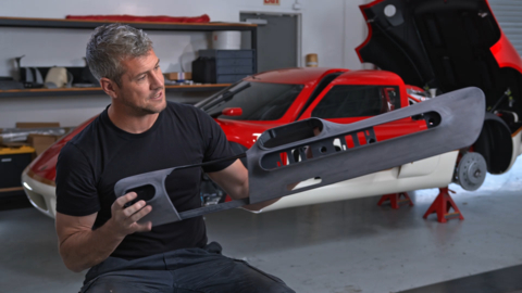 Ant Anstead shows a 3D-printed part for the Lotus Type 62-2 coachbuilt as shown in the Discovery+ documentary, Radford Returns (Photo: Business Wire)