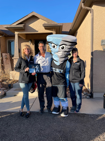 Left to right - CEO Deb Rand and COO David Shipley of Highline South/West stand with the Pueblo West Cyclones Mascot. (Photo: Business Wire)