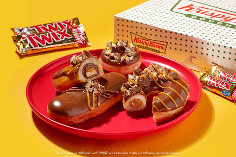 Three new doughnuts created by two beloved brands available beginning Feb. 21, including one with a full-sized TWIX® Cookie Bar inside! (Photo: Business Wire)