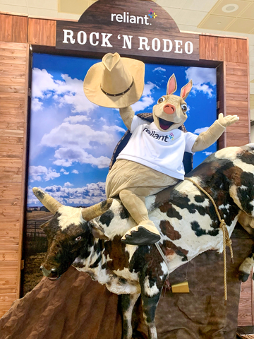 original Reliant mascot Hugo enjoys the new "Rock n’ Rodeo" activation at the 2022 Houston Livestock Show and Rodeo, located in NRG Center Hall C. (Photo: Business Wire)