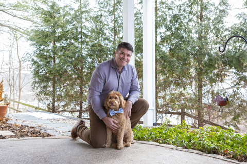 Compana Pet Brands CEO John Howe with goldendoodle Bear, taken at his home in St. Louis, Missouri. (Photo: Business Wire)