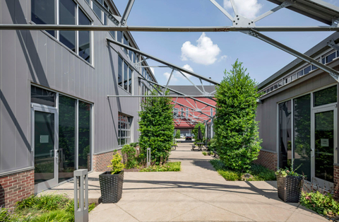 The Sheds on Charlotte is a <percent>100%</percent> leased, 85,032 square foot, six-building office and retail campus in Nashville, TN. Located in the Midtown/West End neighborhood along Charlotte Avenue, it has high visibility and easy access to downtown Nashville, I-440, I-40 and affluent neighborhoods to the west. (Photo: Business Wire)