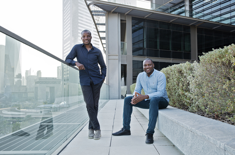 thumbnail Moove co-founders - Jide Odunsi (standing) Ladi Delano (seated) (Photo: Business Wire)