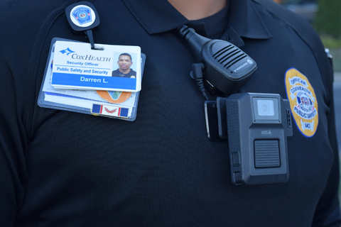 AXIS W100 body worn camera worn by CoxHealth public safety and security officer. (Photo: Business Wire)