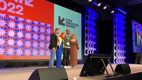 Asad Lesani, Co-Founder and CEO at Bluecity (left), Austin Wilson, Director of Intelligent Infrastructure Solution at Velodyne Lidar (right center), and Sally Frykman, CMO at Velodyne Lidar (right), accept the 2022 SXSW Innovation Award for Intelligent Infrastructure Solution on March 14, 2022. Ingrid Vanderveldt, SXSW Awards Event Emcee (left center). Photo Credit: Velodyne Lidar