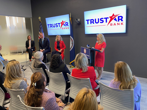 First Lady Suzanne Youngkin, Governor Glenn Youngkin, and Secretary of Commerce and Trade Caren Merrick look on as Trustar Bank CEO Shaza Andersen speaks to the crowd. (Photo: Business Wire)
