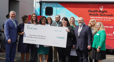 Tadd Haynes, president, UniCare Health Plan of West Virginia and the UniCare team present a $1 million check to Angie Settle, chief executive officer, West Virginia Health Right. (Photo: Business Wire)