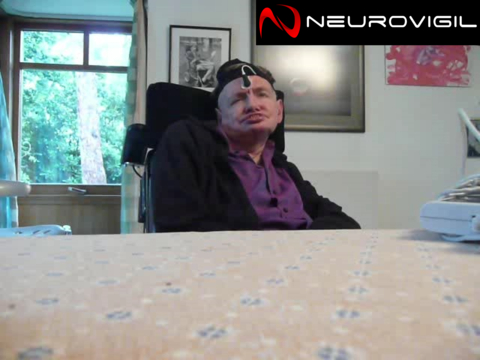 Stephen Hawking, a former member of the NeuroVigil Scientific Advisory Board, sporting an iBrain 1 in his kitchen in 2011. Thanks to his participation as a research subject, NeuroVigil launched its brain-based communication program, and on May 21st, 2013, Augie Nieto became the first person to communicate with iBrain. (Photo: NeuroVigil)