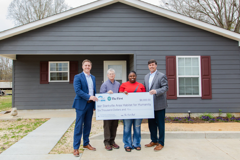 From left to right: Steven Coleman, market president, The First; Joel Downey, executive director, Starkville Habitat; Keva Robertson, HELP recipient and homeowner; Gregory Thames, North Mississippi division president, The First. (Photo: Business Wire)