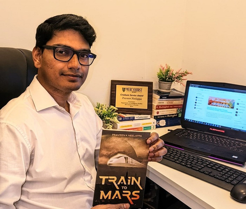 Praveen Kumar Neelappa with his New Book - Train to Mars (Photo: Business Wire)