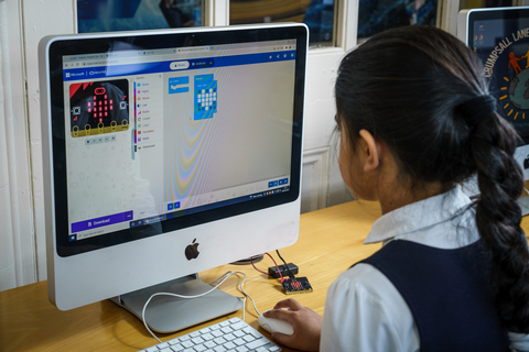 A school girl puts her new coding and digital creativity skills to work. (Photo: Business Wire)