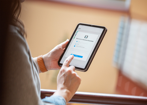 Apple Business Essentials supports small businesses through the entire device management life cycle, beginning with streamlined employee onboarding. At Espresso Services Inc., an employee begins onboarding with the Apple Business Essentials app. (Photo: Business Wire)