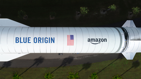 Overhead of the New Glenn rocket from Blue Origin, one of the three heavy-lift launch providers Amazon selected for Project Kuiper (featuring a mock-up of the Amazon logo) (Photo: Business Wire)