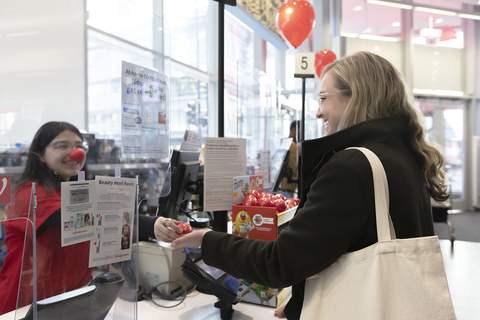 A woman purchases a Red Nose at her local Walgreens to support Red Nose Day and help end the cycle of child poverty. (Photo: Business Wire)
