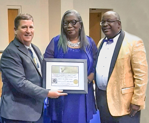 Chris Brown (Senior Manager of Community Relations at Enviva) accepts award from Deborah Dicks Maxwell (President of North Carolina NAACP) and Dr. Kennedy Barber (President of Bertie County NAACP). (Photo: Business Wire)