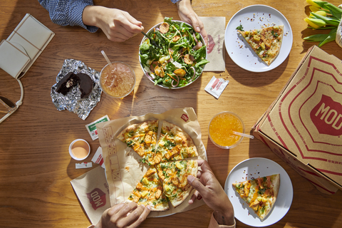 original MOD spring menu offerings – the Jasmine Pizza and the Zesty Asian Pineapple Salad (Photo: Business Wire)
