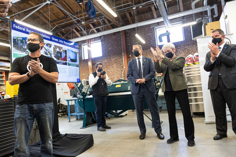 LACI CEO Matt Petersen, Energy Secretary Granholm and Labor Secretary Walsh applauding new cleantech developments and Green Jobs Workforce training happening in LACI’s Advanced Prototyping Center. (Photo: Business Wire)