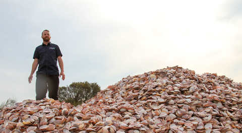 thumbnail Simon Branigan rides a wave of recycled seashells destined to become bedrock for new shellfish reefs ©Fiona Pepper