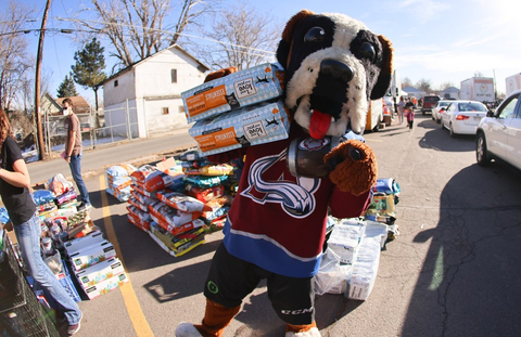 National Hockey League's Colorado Avalanche mascot Bernie the St. Bernard holds "I and love and you" donated pet food bags over their shoulder at the donation day events. (Photo: Business Wire)