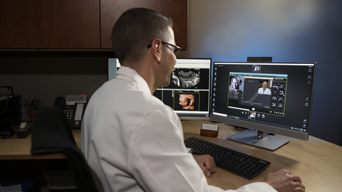 A physician conducts a telemedicine visit with his sonographer and patient, using Collaboration Live. (Photo: Philips Healthcare)