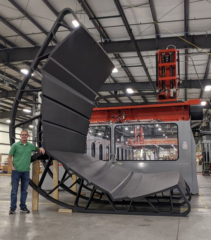 This is a yacht hull fiberglass layup tool manufactured by Thermwood on its LSAM printer using Techmer PM’s Electrafil® 3DP carbon-fiber-reinforced additive manufacturing material. It is pictured here with Thermwood LSAM Product Manager Scott Vaal. (Photo courtesy of Thermwood Corp.)