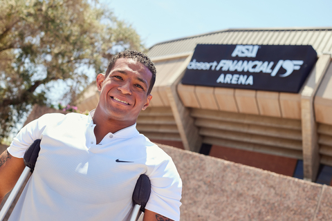NCAA national champion wrestler, author, motivational speaker, Mesa High School wrestling coach and new Desert Financial Credit Union spokesperson Anthony Robles outside Desert Financial Arena. (Photo: Business Wire)